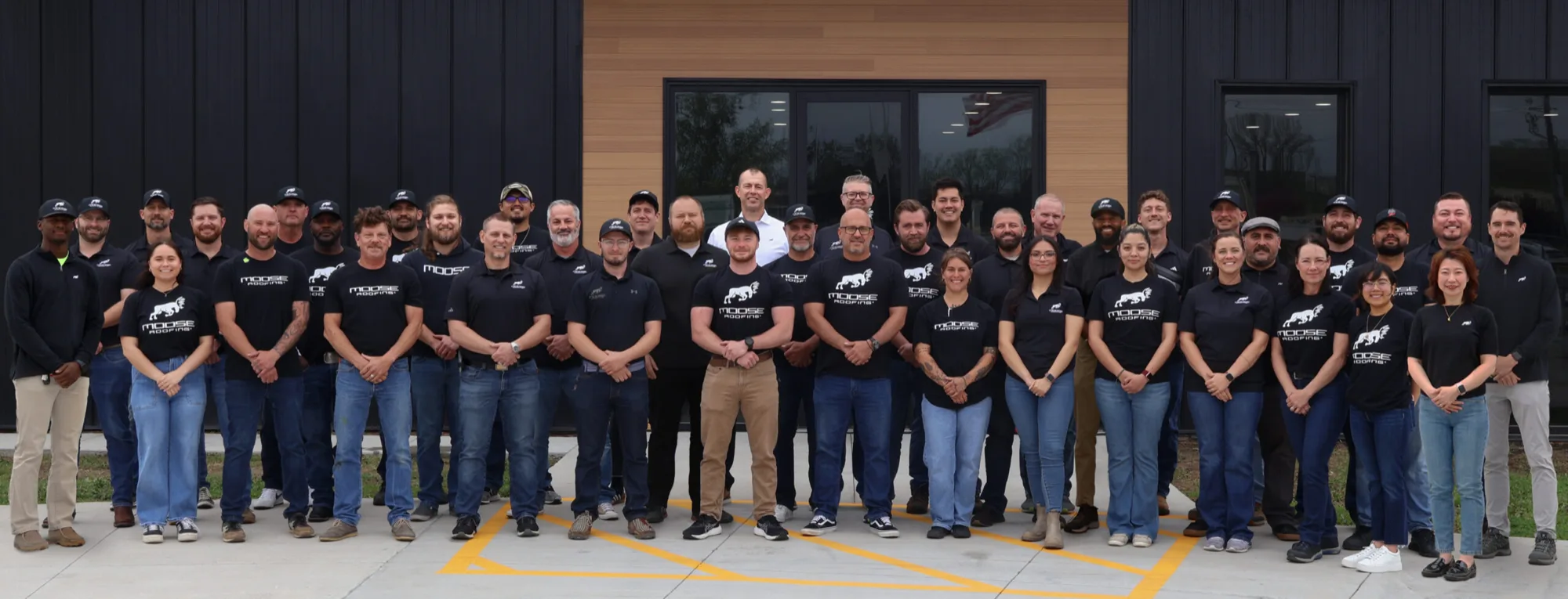 The Moose Roofing team outside their Omaha headquarters